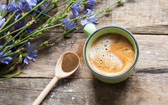 A cup of coffee and some flowers